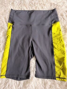 Fabletics Charcoal Gray Bike Shorts with Neon Yellow Stripe